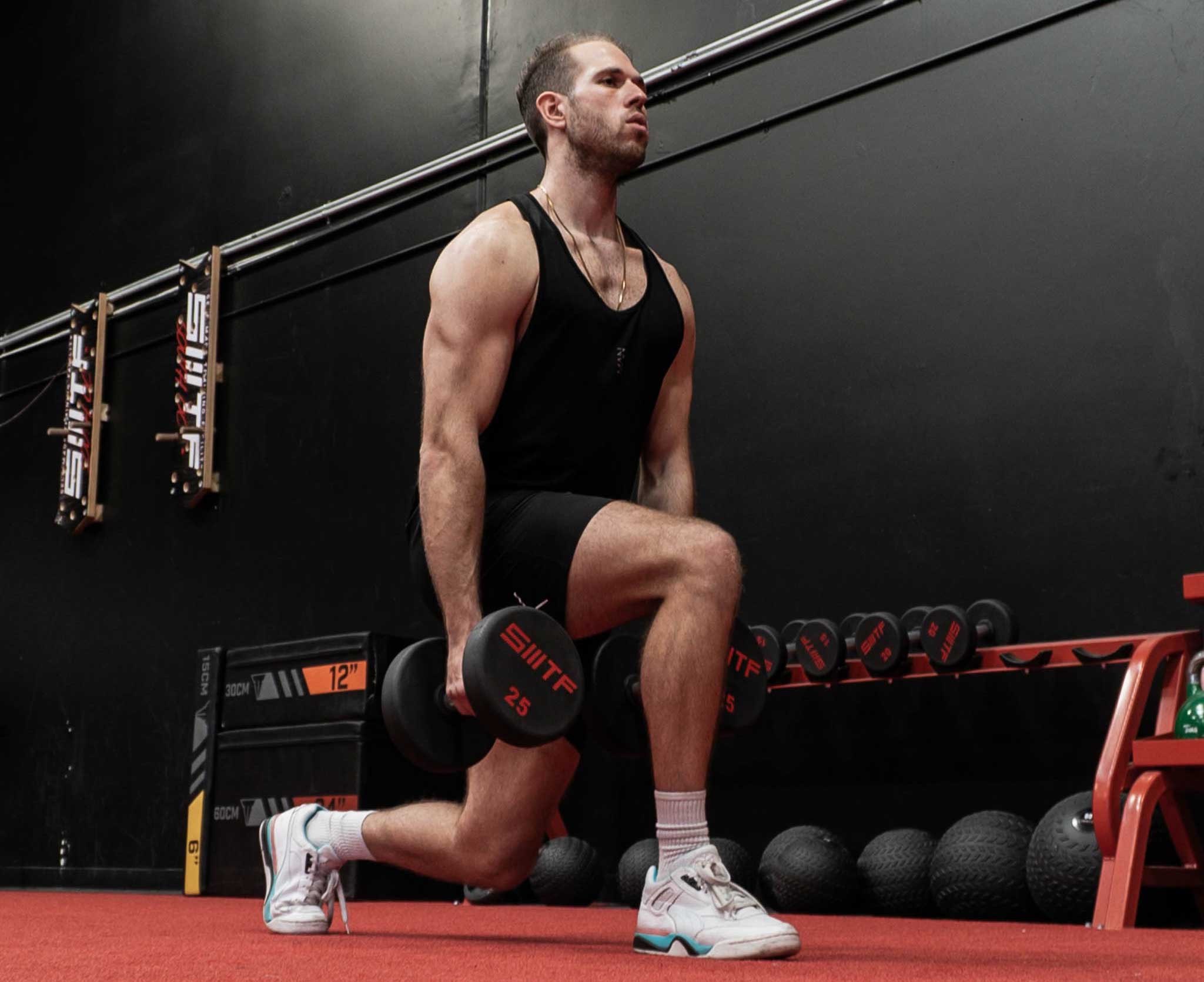 Coach performing an exercise in a gym